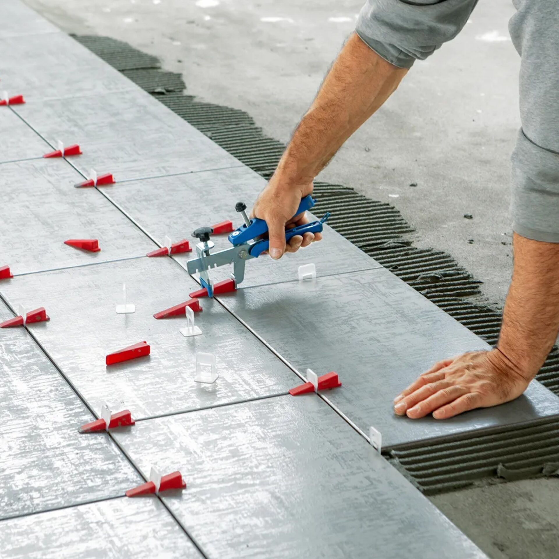 Flooring professional installing tile flooring