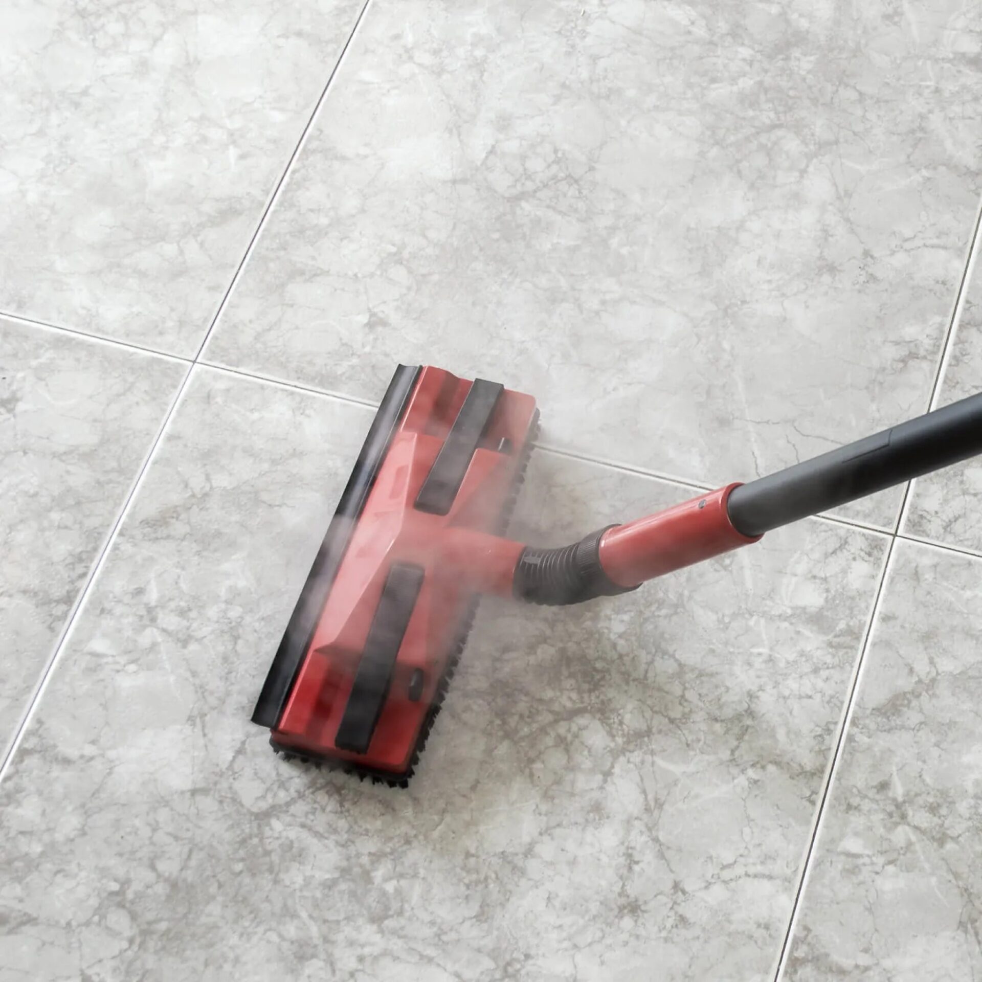 Steaming mop used on tile flooring
